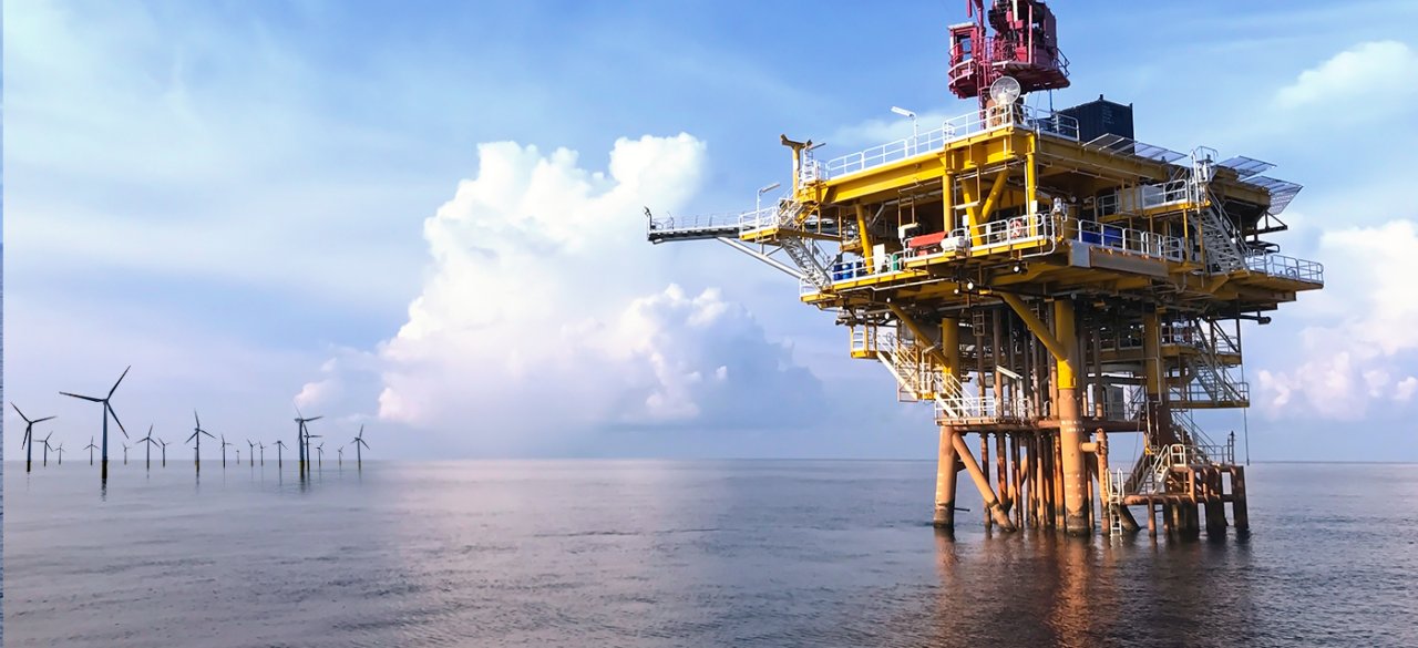 Image of an offshore wind farm and oil platform