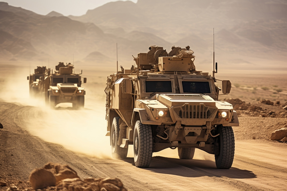 Image of troop transport vehicles in the desert